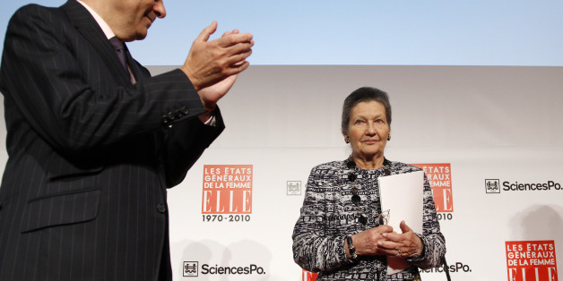 French Prime Minister Francois Fillon (L) applauds as French politician and Academician Simone Veil arrives at the Women's Assembly organised by French weekly magazine Elle at the Sciences Politiques high-school in Paris May 7, 2010. REUTERS/Benoit Tessier (FRANCE - Tags: POLITICS SOCIETY)
