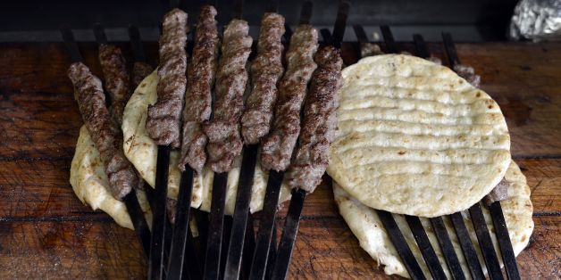 Photo shows skewers of grilled kebab on pita bread at a kebab-souvlaki restaurant in the Monastiraki district of Athens on November 10, 2014. AFP PHOTO/ LOUISA GOULIAMAKI (Photo credit should read LOUISA GOULIAMAKI/AFP/Getty Images)