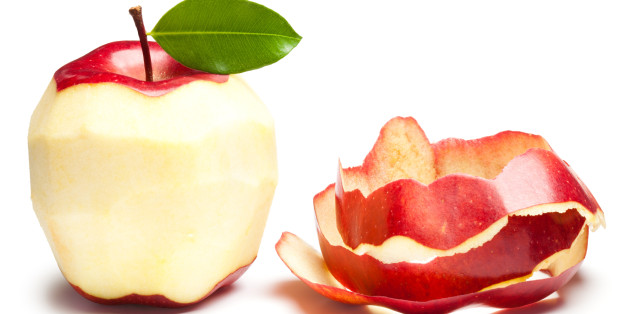 'Peeled Apple with green leaf on white. This file is cleaned, retouched and contains'
