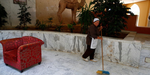 Khadidja, 60, the only housekeeper kept at her job to maintain the cleanliness of the Imperial Marhaba hotel, which is still closed after it was attacked by a gunman last year, sweeps up the floor at the empty hotel, in Sousse, Tunisia, June 22, 2016. "We think we will re-open next year," said hotel manager Mehrez Saadi. "For now we start by changing the name from the Imperial Marhaba to Kantaoui Bay." REUTERS/ Zohra Bensemra SEARCH "ZOHRA SOUSSE" FOR THIS STORY. SEARCH "THE WIDER IMAGE" FOR ALL STORIES