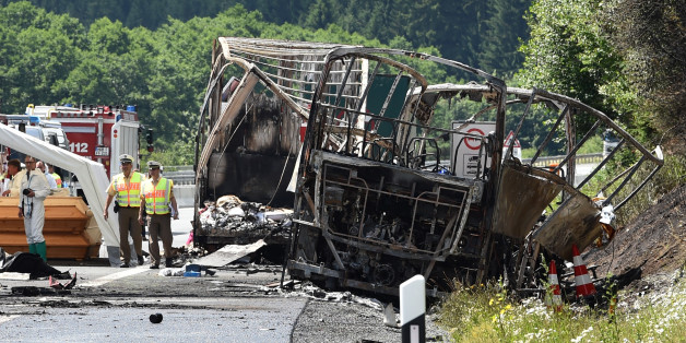 Policemen and forensic experts work at the scene where a tour bus burst into flames following a collision with a trailer truck on the highway A9 near Münchberg, southern Germany, on July 3, 2017, where up to 17 people are feared dead / AFP PHOTO / Christof STACHE (Photo credit should read CHRISTOF STACHE/AFP/Getty Images)