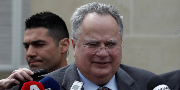Greek Foreign Minister Nikos Kotzias talks to media after a meeting with Cypriot President Nicos Anastasiades at the presidential palace in Nicosia, Cyprus March 27, 2017. REUTERS/Yiannis Kourtoglou
