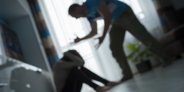 Man yelling at woman on the floor