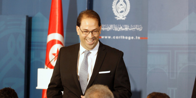 Tunisia's Prime Minister-designate Youssef Chahed smiles during a news conference after his meeting with Tunisia's President Beji Caid Essebsi (not pictured) in Tunisia, Tunis August 3, 2016. REUTERS/Zoubeir Souissi