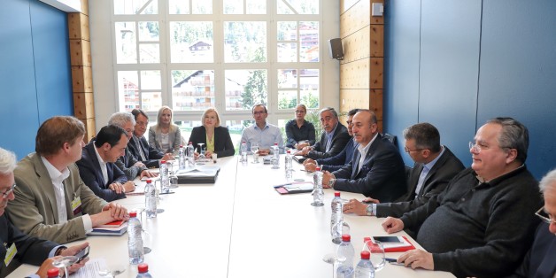 CRANS-MONTANA, SWITZERLAND - JULY 1: Foreign Affairs Minister of Turkey Mevlut Cavusoglu (3rd R), Turkish Cypriot leader Mustafa Akinci (5th R), Foreign Affairs Minister of Greece Nikos Kotzias (R) and Greek Cypriot leader Nicos Anastasiades (4th L) attend an undetailed meeting, which is held under the presidency of UN special envoy on Cyprus Espen Barth Eide (C) during the fourth day of Cyprus Conference in Crans-Montana, Switzerland on July 1, 2017. (Photo by Cem Ozdel/Anadolu Agency/Getty Ima