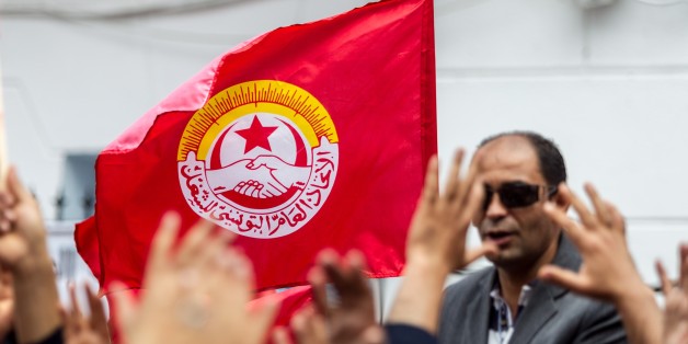 TUNIS, TUNISIA - MAY 1 : Tunisians gather outside the headquarters of the Tunisian General Labour Union UGTT to attend a May Day Rally in Tunis, Tunisia on May 1, 2016. (Photo by Amine Landoulsi/Anadolu Agency/Getty Images)