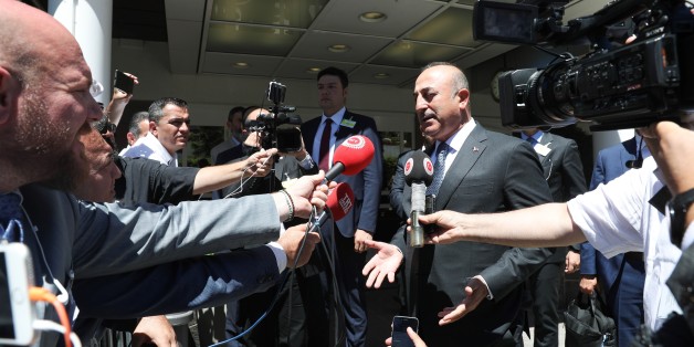 CRANS-MONTANA, SWITZERLAND - JUNE 30: UN Secretary General Antonio Guterres (C) attends a dinner hosted by him with Turkish Foreign Minister Mevlut Cavusoglu (2nd L), British Minister of State for Europe and the Americas Alan Duncan (L), Greek Foreign Minister Nikos Kotzias (2nd R) UN special envoy on Cyprus Espen Barth Eide (not seen), Turkish Cypriot leader Mustafa Akinci (not seen) and Greek-Cypriot leader Nicos Anastasiades (not seen) during the third day of the Cyprus Conference in Crans-Mo