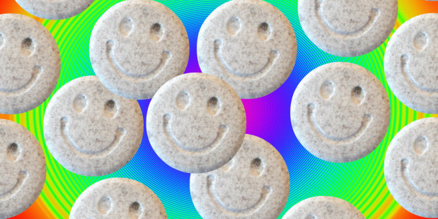 Ecstasy. Tablets of the illegal drug ecstasy (3, 4- methylenedioxymethamphetamine or MDMA). Ecstasy induces feelings of elation, energy and well- being. Possible side effects include dehydration, involuntary muscle movements and psychological difficulties. There is some evidence that long term use may cause brain damage. The \smiley\ symbol on the tablets was an emblem adopted by the 1980s acid house dance music culture that popularised the use of ecstasy as a recreational drug.