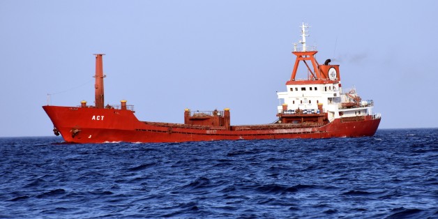 MUGLA, TURKEY - JULY 03: A Turkish commercial ship named 'ACT' is seen on Aegean coast of western Turkey's Mugla province on July 03, 2017 as Turkish Coastal Guard boats (not seen) escort after Greek coastal guard boats allegedly opened fire on it. Greek coastal guard boats Monday allegedly opened fire on a Turkish commercial ship at international waters in the Aegean Sea off the coast of Rhodes, according to Turkish Interior Ministry sources. The ship named 'ACT' was brought to Turkish waters b