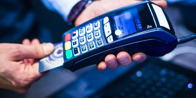 man put the credit card into a reader