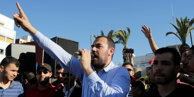 Moroccan activist and the leader of the protest movement Nasser Zefzafi gives a speech during a demonstration in the northern town of Al-Hoceima, seven months after a fishmonger was crushed to death inside a garbage truck as he tried to retrieve fish confiscated by the police, in Al-Hoceima, Morocco May 18, 2017. REUTERS/Youssef Boudlal