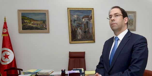Tunisian Prime Minister Youssef Chahed stands during a meeting with the French foreign minister during a meeting on June 5, 2017 in Tunis.
French Foreign Minister Jean Yves Le Drian is on a two-day official visit to Tunisia. / AFP PHOTO / FETHI BELAID (Photo credit should read FETHI BELAID/AFP/Getty Images)