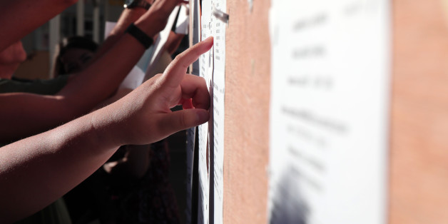 Students react as they check the results of the baccalaureat exam (high school graduation exam) on July 5, 2017 in Saint-Denis, on the French indian ocean island of La Réunion. / AFP PHOTO / Richard BOUHET (Photo credit should read RICHARD BOUHET/AFP/Getty Images)