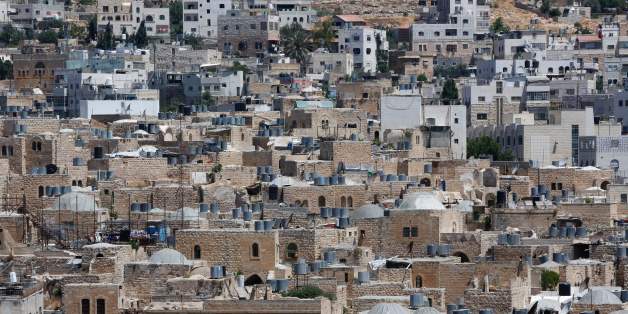 A picture taken on June 29, 2017 shows a view of the houses in the old town of the divided city of Hebron in the southern West Bank.
On July 7, 2017 UNESCO declared in a secret ballot the Old City of Hebron in the occupied West Bank a protected heritage site.
Hebron is home to more than 200,000 Palestinians, and a few hundred Israeli settlers who live in a heavily fortified enclave near the site known to Muslims as the Ibrahimi Mosque and to Jews as the Cave of the Patriarchs. / AFP PHOTO / HAZEM BADER (Photo credit should read HAZEM BADER/AFP/Getty Images)