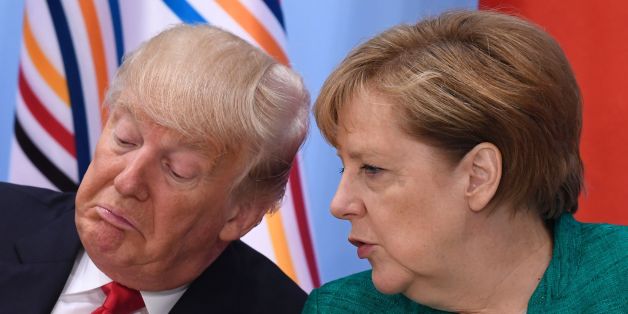 US President Donald Trump (L) and German Chancellor Angela Merkel attend a panel discussion on the second day of the G20 Summit in Hamburg, Germany, July 8, 2017.
Leaders of the world's top economies gather from July 7 to 8, 2017 in Germany for likely the stormiest G20 summit in years, with disagreements ranging from wars to climate change and global trade. / AFP PHOTO / SAUL LOEB (Photo credit should read SAUL LOEB/AFP/Getty Images)