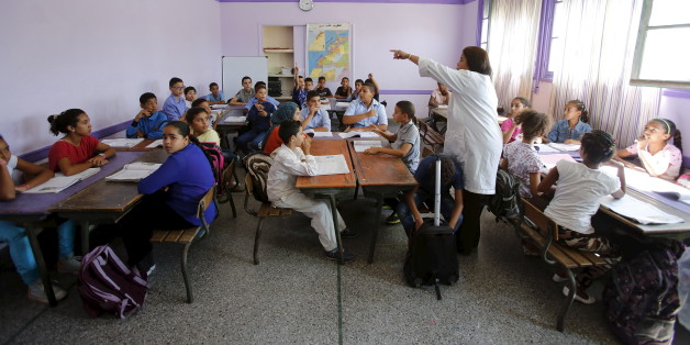 Schoolchildren listen to a teacher as they study during a class in the Oudaya primary school in Rabat, September 15, 2015, at the start of the new school year in Morocco. Nearly three years after Taliban gunmen shot Pakistani schoolgirl Malala Yousafzai, the teenage activist last week urged world leaders gathered in New York to help millions more children go to school. World Teachers' Day falls on 5 October, a Unesco initiative highlighting the work of educators struggling to teach children amid