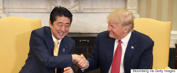 trump abe shake hands feb