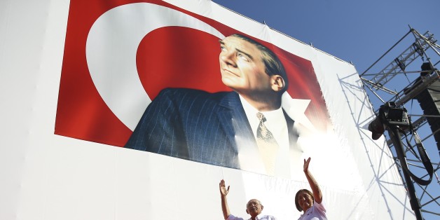 ISTANBUL, TURKEY - JULY 09: Main opposition Republican Peoples Party (CHP) leader Kemal Kilicdaroglu and his wife Selvi Kiicdaroglu greet crowd during CHP rally in Istanbul's Maltepe district, on July 9, 2017. The rally held on Kilicdaroglu's 25th day of protest march from Ankara to Istanbul protesting a judicial decision against one of his party lawmakers.
(Photo by Emrah Yorulmaz/Anadolu Agency/Getty Images)