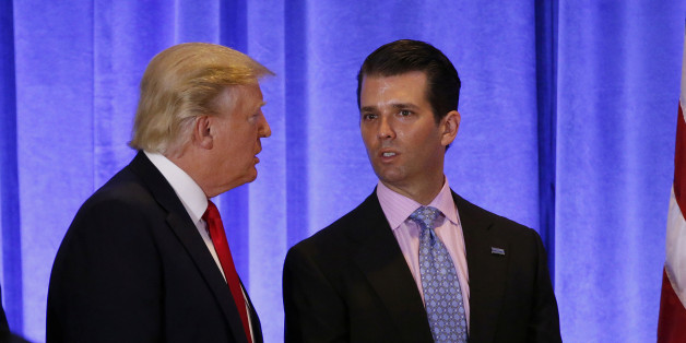 U.S. President-elect Donald Trump speaks with his son Donald Trump Jr. during a news conference in the lobby of Trump Tower in Manhattan, New York City, U.S., January 11, 2017. REUTERS/Lucas Jackson