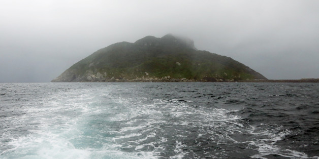 This September 30, 2016 picture shows a view of Okinoshima island, some 60 kilometres from Munakata city, Fukuoka prefecture.The island of Okinoshima and associted sites in the Munakata Region have been inscribed at the 41st session of the UNESCO World Heritage Committee held in Poland on July 9, 2017. / AFP PHOTO / JIJI PRESS / STR / Japan OUT (Photo credit should read STR/AFP/Getty Images)