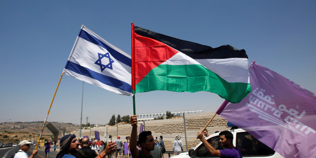 Palestinian and Israeli activists take part in a protest demanding end of Israeli occupation and calling for a better future for both people, in the West Bank city of Bethlehem July 7, 2017. REUTERS/Mussa Qawasma