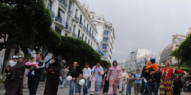 Algerian children with their families walk in Algiers' main street of Didouch Mourad on May 16, 2008 as the local municipality authorities called for a 'day without vehicles' in the capital's center. The municipality asked residents to walk, bike and ride on public transport instead of driving cars, for reducing pollution. AFP PHOTO/FAYEZ NURELDINE (Photo credit should read FAYEZ NURELDINE/AFP/Getty Images)