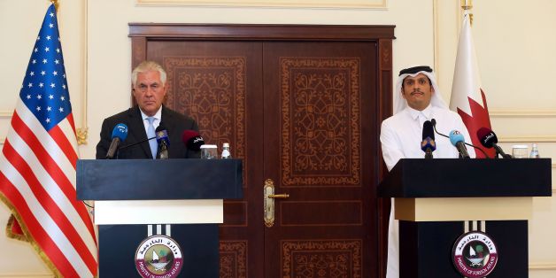 US Secretary of State Rex Tillerson and Qatari Foreign Minister Sheikh Mohammed bin Abdulrahman Al-Thani listen to questions by journalists during a press conference in Doha, on July 11, 2017.The US and Qatar announced they have signed an agreement on fighting terrorism, at a time when the emirate is facing sanctions from neighbouring countries which accuse it of supporting extremism. / AFP PHOTO / STRINGER (Photo credit should read STRINGER/AFP/Getty Images)