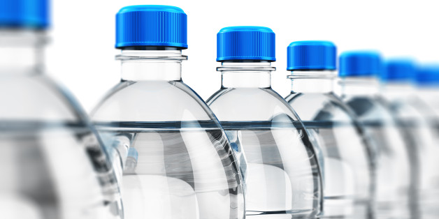 3D render illustration of the row of plastic bottles with clear purified drink carbonated water isolated on white background with selective focus effect