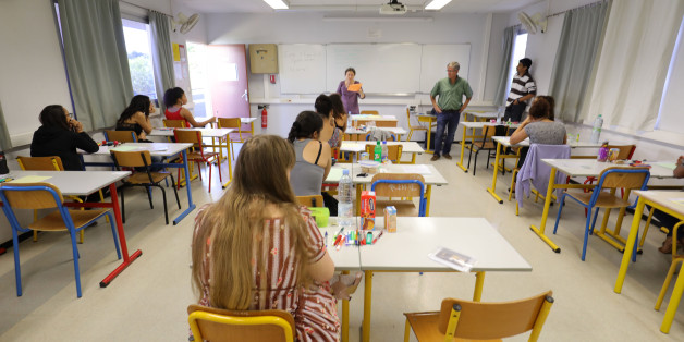 Pupils wait for the start of the first written test in philosophy as part of the Baccalaureat (France's high school diploma) at a school in La Possession, on the French indian island ocean of La Reunion. / AFP PHOTO / Richard BOUHET (Photo credit should read RICHARD BOUHET/AFP/Getty Images)