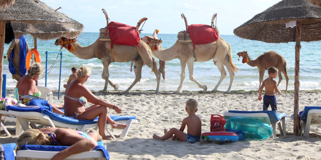 Tourists relax on a beach on the island of Djerba, Tunisia, September 7, 2016. REUTERS/Zoubeir Souissi