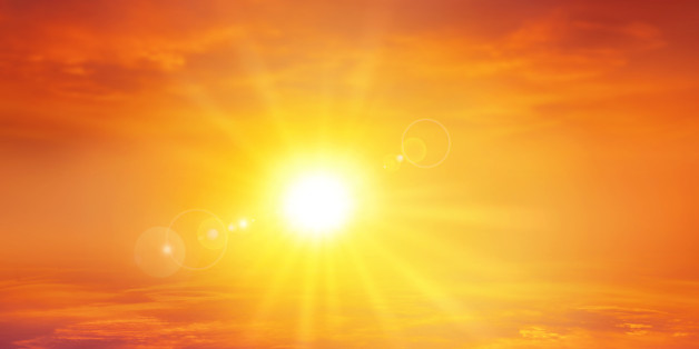 High resolution sky background with a radiant setting sun