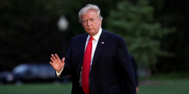 U.S. President Donald Trump waves as walks on the South Lawn of the White House upon his return to Washington, U.S., from the G20 Summit in Hamburg, July 8, 2017. REUTERS/Yuri Gripas