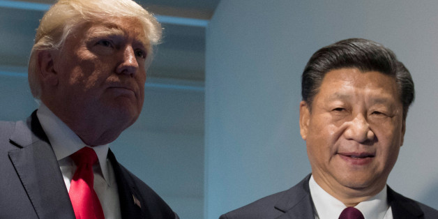 U.S. President Donald Trump and Chinese President Xi Jinping (R) meet on the sidelines of the G20 Summit in Hamburg, Germany, July 8, 2017. REUTERS/Saul Loeb, Pool
