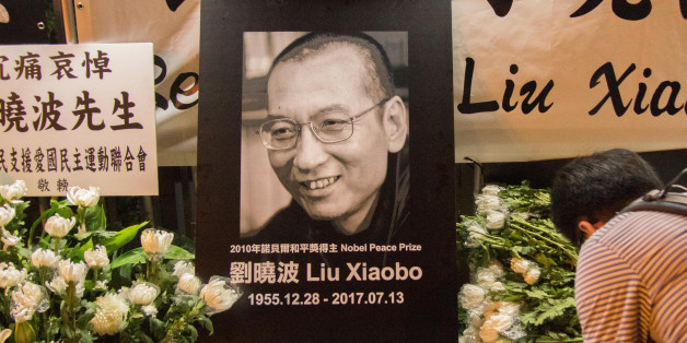HONG KONG, CHINA - JU;Y 13: Residents of Hong Kong host a vigil service outside the Chinese Liason Office of Hong Kong after the death of Human Right Activist and Nobel Peace Prize Winner Liu Xiaobo on July 13, 2017 in Hong Kong, China. Liu Xiaobo had been prisoned by the Chinese authority since 2008 for charges made against him for 'suspicion of inciting subversion of state power.'PHOTOGRAPH BY Geovien So / Barcroft ImagesLondon-T:+44 207 033 1031 E:hello@barcroftmedia.com -New York-T:+1 212 79