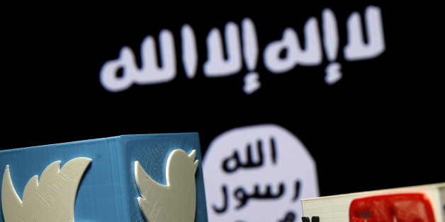 A 3D plastic representation of the Twitter and Youtube logo is seen in front of a displayed ISIS flag in this photo illustration in Zenica, Bosnia and Herzegovina, February 3, 2016. Iraq is trying to persuade satellite firms to halt Internet services in areas under Islamic State's rule, seeking to deal a major blow to the group's potent propaganda machine which relies heavily on social media to inspire its followers to wage jihad. Picture taken February 3, 2016. To match Insight MIDEAST-CRISIS/I