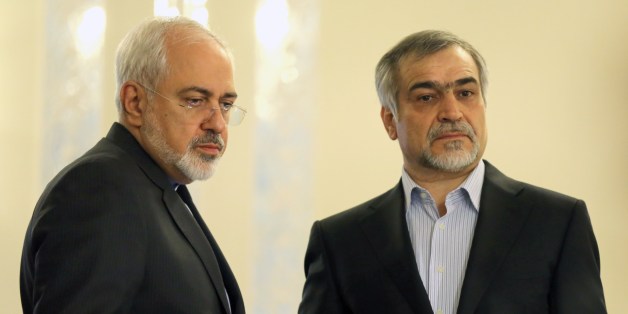 Iranian Foreign Minister Javad Zarif (L) and Hossein Fereydoun, President Rouhani's younger brother and advisor, look on during a press conference of President Hassan Rouhani (unseen) in Tehran on April 3, 2015. Iran vowed to stand by a nuclear deal with world powers as Rouhani promised it would open a 'new page' in the country's global ties. AFP PHOTO/ATTA KENARE (Photo credit should read ATTA KENARE/AFP/Getty Images)