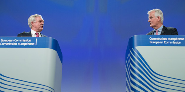 David Davis, U.K. exiting the European Union (EU) secretary, left, speaks as Michel Barnier, chief negotiator for the European Union (EU), listens during a news conference following the start of Brexit negotiations in Brussels, Belgium, on Monday, June 19, 2017. The U.K. and the European Union moved to reassure millions of their citizens that they won't be forced to leave their homes or find new jobs after Brexit, as negotiations on Britain's withdrawal finally got under way. Photographer: Jasper Juinen/Bloomberg via Getty Images