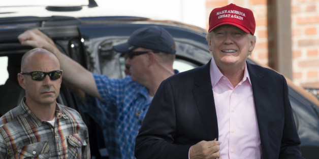 US President Donald Trump arrives at the 72nd US Women's Open Golf Championship at Trump National Golf Course in Bedminster, New Jersey, July 16, 2017. / AFP PHOTO / SAUL LOEB (Photo credit should read SAUL LOEB/AFP/Getty Images)