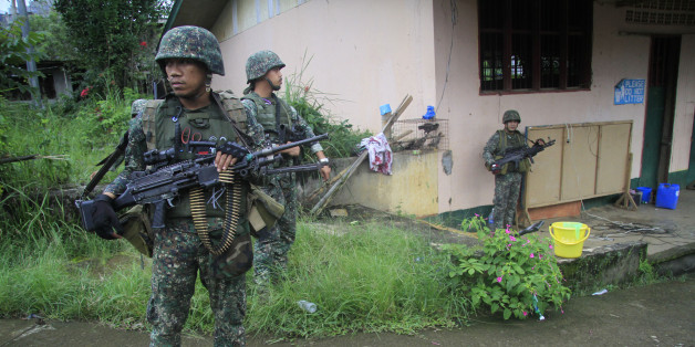 This photo taken on July 12, 2017 shows Philippine troops standing guard prior to a patrol in Marawi on the southern island of Mindanao.
A Philippine military jet accidentally killed two soldiers and injured 11 others as troops fought to retake a southern city from pro-Islamic State group militants, the military said on July 13, 2017. / AFP PHOTO / RICHEL UMEL (Photo credit should read RICHEL UMEL/AFP/Getty Images)