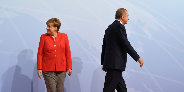 German Chancellor Angela Merkel greets Turkey's President Recep Tayyip Erdogan at the beginning of the G20 summit in Hamburg, Germany, July 7, 2017. REUTERS/Bernd Von Jutrczenka/POOL
