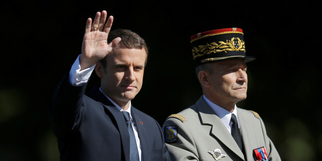 French President Emmanuel Macron and Chief of the Defence Staff French Army General Pierre de Villiers arrive in a command car for the traditional Bastille Day military parade on the Champs-Elysees in Paris, France, July 14, 2017. REUTERS/Stephane Mahe