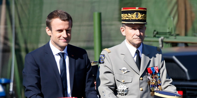 French President Emmanuel Macron (L) and Chief of the Defence Staff French Army General Pierre de Villiers (R) attend the traditional Bastille Day military parade on the Champs-Elysees in Paris, France, July 14, 2017. Picture taken July 14, 2017. REUTERS/Charles Platiau