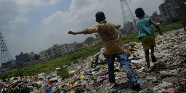 Children's are passing joyful time in the garbage area located besides river Buriganga on July 16 2017 in Dhaka Bangladesh. Buriganga river, which flows by Dhaka is now one of the most polluted rivers in Bangladesh because of rampant dumping of industrial and human waste. (Photo by Syed Mahamudur Rahman/NurPhoto via Getty Images)