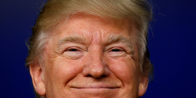 U.S. President Donald Trump smiles while hosting a CEO town hall on the American business climate at the Eisenhower Executive Office Building in Washington, U.S., April 4, 2017. REUTERS/Kevin Lamarque