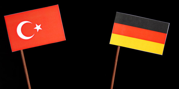 Turkish flag with German flag isolated on black background