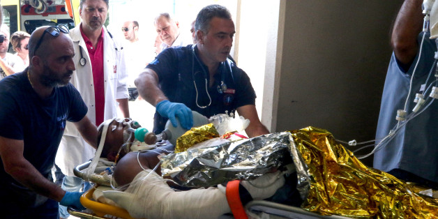 Emergency workers use a trolley to take as a person injured in an earthquake on the Greek island of Kos as they arrive for treatment on the island of Crete in Heraklion on July 21, 2017. Two foreigners died and more than 100 people were injured on the Greek island of Kos when an earthquake shook popular Greek and Turkish holiday destinations in the Aegean Sea. The epicentre of the 6.7 magnitude quake was some 10.3 kilometres (6.4 miles) south of the major Turkish resort of Bodrum, a magnet for