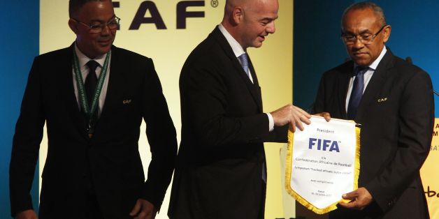 Recently elected president of the African Football Confederation (CAF) Ahmad Ahmad (R), FIFA president Gianni Infantino (C) and Royal Moroccan Football Federation president Fouzi Lekjaa attend the first ever African Football Symposium in Skhirat, on the outskirts of the Moroccan capital, on July 18, 2017. Delegates from CAF's 55 member federations, coaches, retired players as well as top football officials from FIFA are in the Moroccan capital to discuss, among other issues, the future of Afric