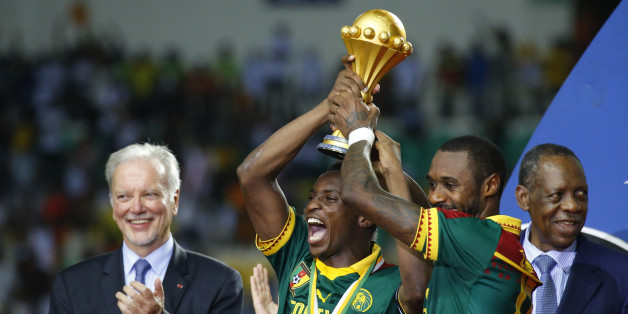 Football Soccer - African Cup of Nations - Final - Egypt v Cameroon - Stade d'Angondjé - Libreville, Gabon - 5/2/17 Cameroon's Benjamin Moukandjo and Nicolas Nkoulou celebrate with the trophy and teammates after winning the African Cup of Nations Reuters / Mike Hutchings Livepic