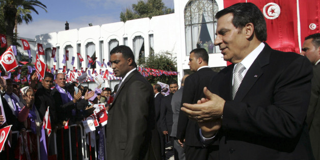 Tunisia's President Zine al-Abidine Ben Ali (R) meets supporters after he took the oath at the national assembly in Tunis November 12, 2009. Ben Ali was re-elected on October 26, with 89.6 percent of the vote for a fifth term after two decades in power. REUTERS/Zoubeir Souissi (TUNISIA POLITICS ELECTIONS)