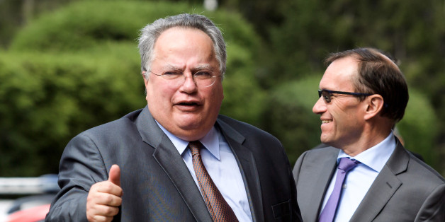 Greek Foreign Minister Nikos Kotzias (L) gives a thumb next to UN envoy Espen Barth Eide upon his arrival for the opening of Cyprus peace talks on June 28, 2017 in the Swiss resort of Crans-Montana.
Rival Cypriot leaders meet to resume efforts to solve one of the world's longest-running political crises in what the island's UN envoy billed as the 'best chance' for peace. The make-or-break talks in Switzerland are geared towards ending the decades-old division of the island and striking a lasting deal between its Greek- and Turkish-speaking communities. / AFP PHOTO / Fabrice COFFRINI (Photo credit should read FABRICE COFFRINI/AFP/Getty Images)